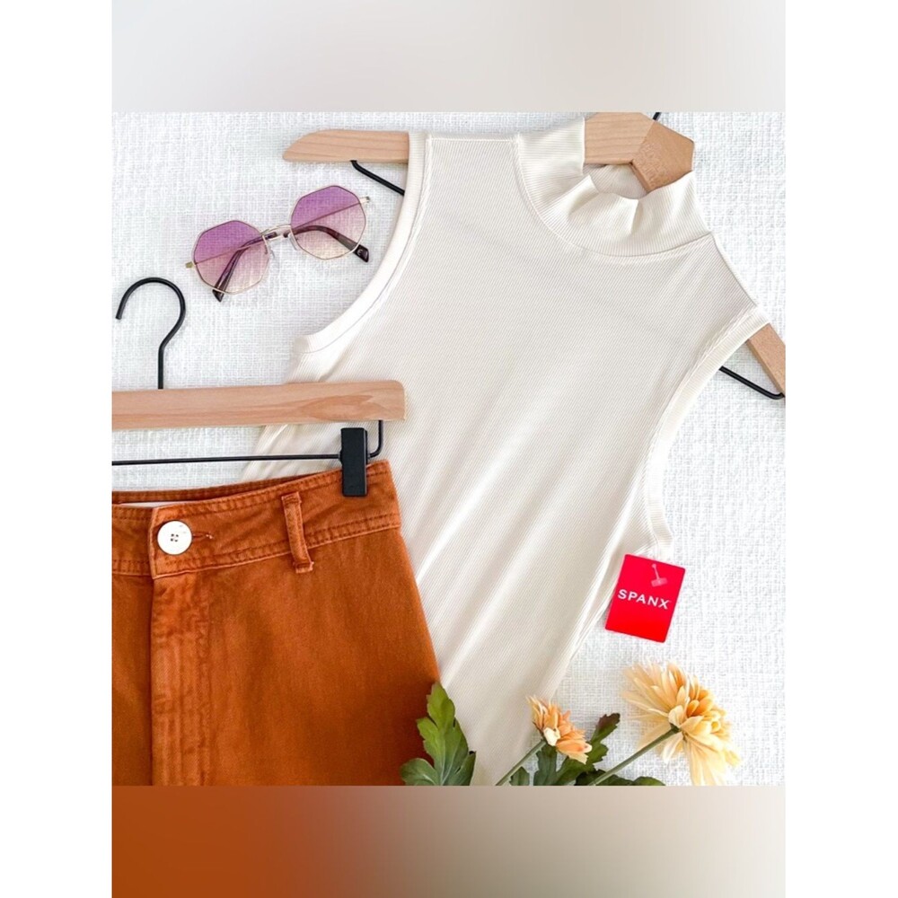 SPANX sleeveless mockneck bodysuit.